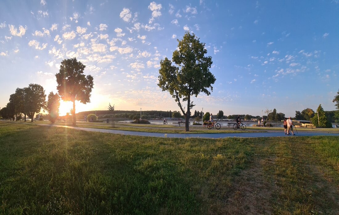 Walking or cycling along the Drava River Promenade